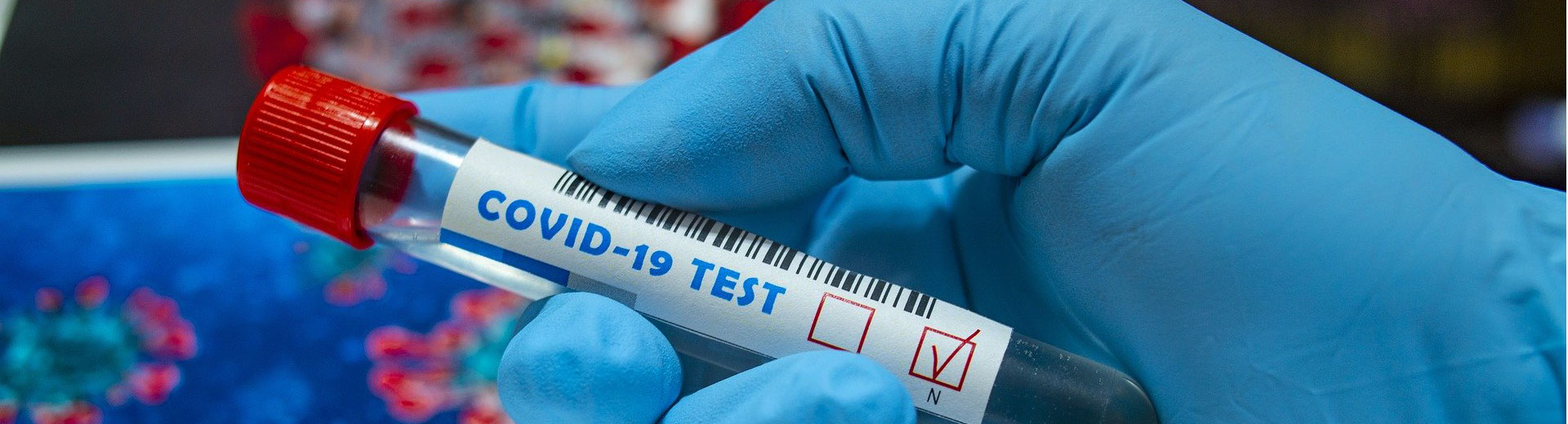 Scientist holding COVID-19 Test tube